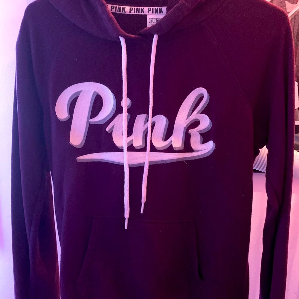 Burgundy Pink brand hoodie trimmed in the white Pink brand logo